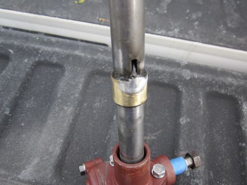 1979 Ford Bronco - Close-up of a steering column component, showing a welded connection and a brass collar.