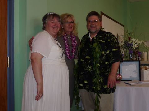 2006 Ford E350 - A group of three people smile for a photo, possibly at an event or celebration.