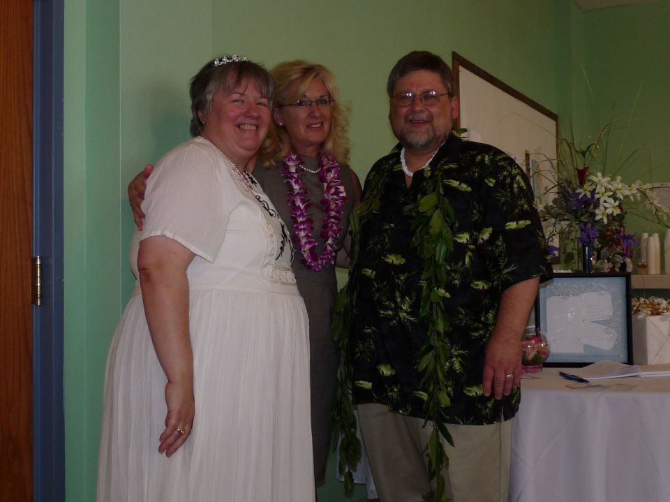 Three people posing for a photo indoors