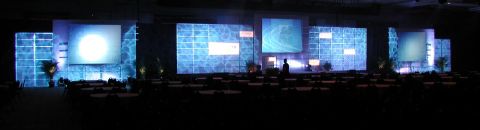1994 Ford Bronco - A large stage setup with illuminated screens and seating arranged in front of it.