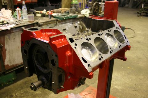 1973 Ford Ranchero - Engine block on a stand in a workshop setting.