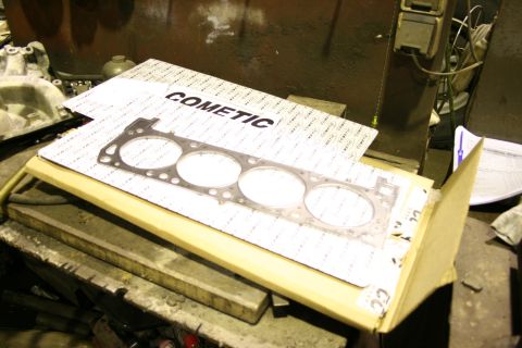 1973 Ford Ranchero - A Cometic engine gasket is shown on a workbench, not a 1973 Ford Ranchero.
