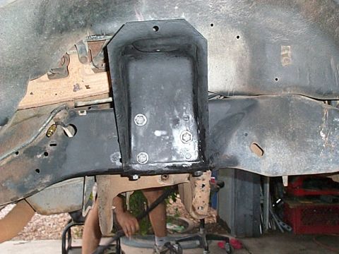 1994 Ford Bronco - Close-up view of a heavy-duty frame mount bracket attached to the vehicle's chassis.