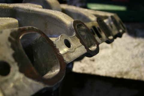 1973 Ford Ranchero - This is a close-up view of an engine intake manifold, showing its internal structure and ports.