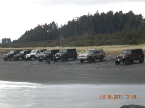 2005 Jeep Wrangler - Multiple Jeep Wranglers and a tan SUV are parked on a beach, with a timestamp of 03.19.2011.