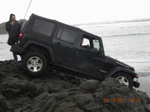2005 Jeep Wrangler - Jeep Wrangler Rubicon navigating rocky terrain near the ocean shore on March 19, 2011.