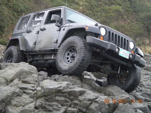 2005 Jeep Wrangler - This Jeep Wrangler appears to be a later model than the registry suggests, possibly a 2007 or newer, navigating rocky terrain.