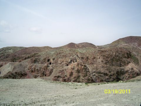 1992 Jeep Wrangler - A desolate landscape of eroded hills and caves, with a date stamp indicating March 19, 2011.