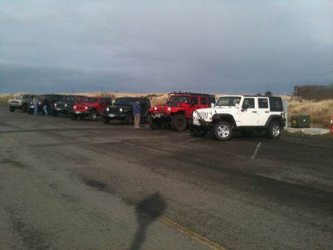 2005 Jeep Wrangler - Multiple Jeep Wranglers are parked in a line on a cloudy day.