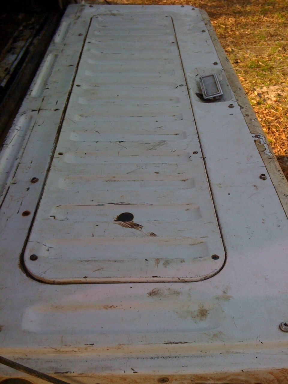 White tailgate with recessed panel and handle