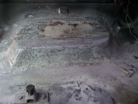 1992 Ford C-350 (Centurion Conversions) - The interior floor pan shows extensive body filler and repair work, indicating past damage or modification.