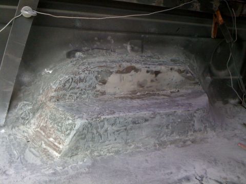 1992 Ford C-350 (Centurion Conversions) - Underside of a vehicle's interior wheel well showing repair and wiring.
