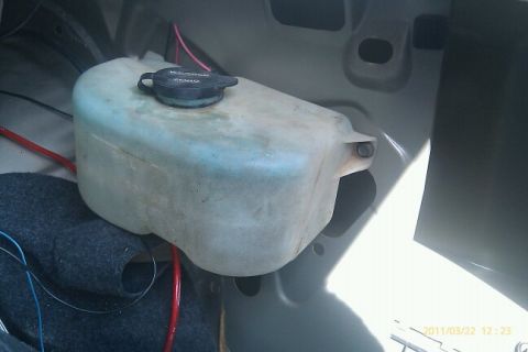 2000 Mercury Grand Marquis - The windshield washer fluid reservoir is visible in the trunk area.