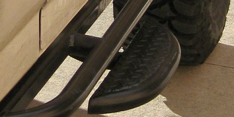 1994 Ford Bronco - Close-up of an aftermarket side step and tire, likely from a truck or SUV.