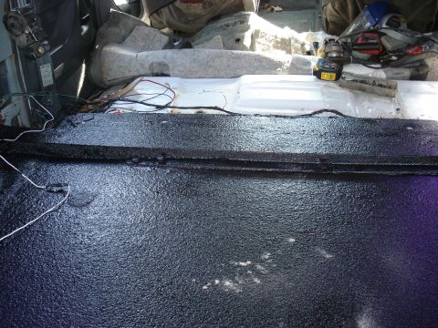 1992 Ford C-350 (Centurion Conversions) - Vehicle interior undergoing repair, focusing on the floor treatment and exposed wiring.
