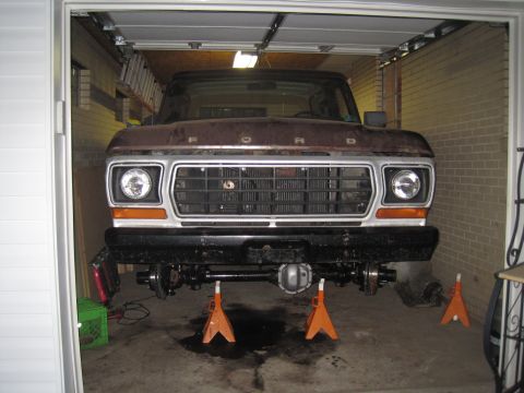 1979 Ford Bronco - This 1979 Ford Bronco's front end is raised on jack stands, revealing its suspension system for maintenance or repair.