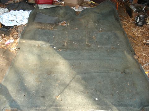 1992 Ford C-350 (Centurion Conversions) - Removed interior carpet for a vehicle, showing the underside and floor area.