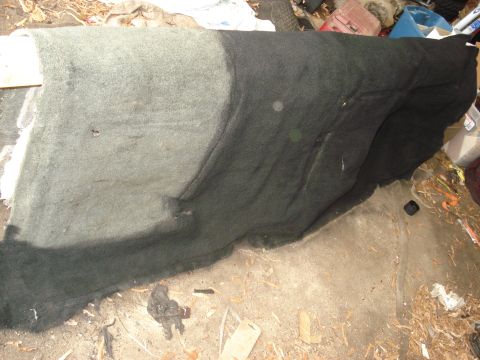 1992 Ford C-350 (Centurion Conversions) - Carpet and floor mat are visible in a cluttered interior space.