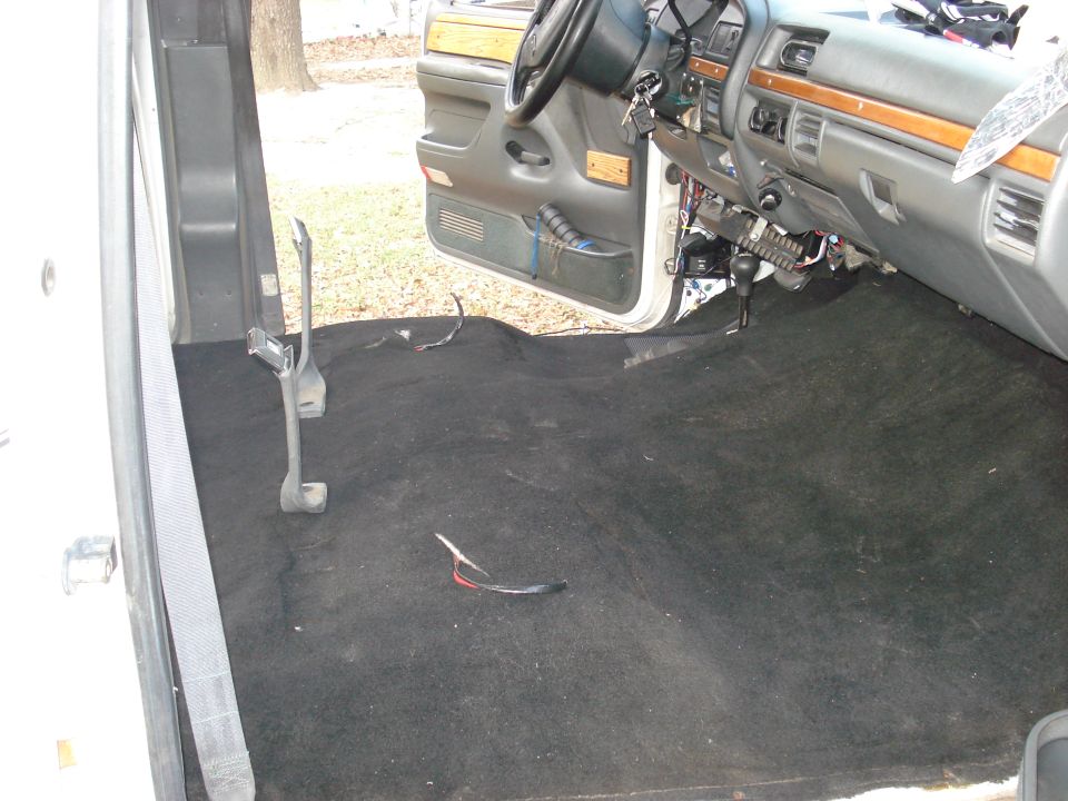 Interior of truck with bare floor and exposed wiring