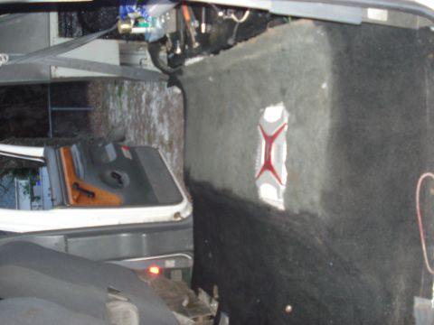 1992 Ford C-350 (Centurion Conversions) - Custom interior work is visible, including carpeting and a decorative emblem on the wall.