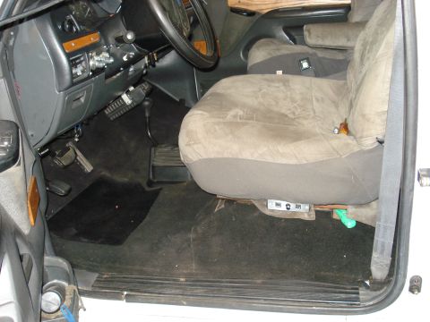 1992 Ford C-350 (Centurion Conversions) - Interior of a 1992 Ford C-350 (Centurion Conversions) van, focusing on the driver's area and seat.