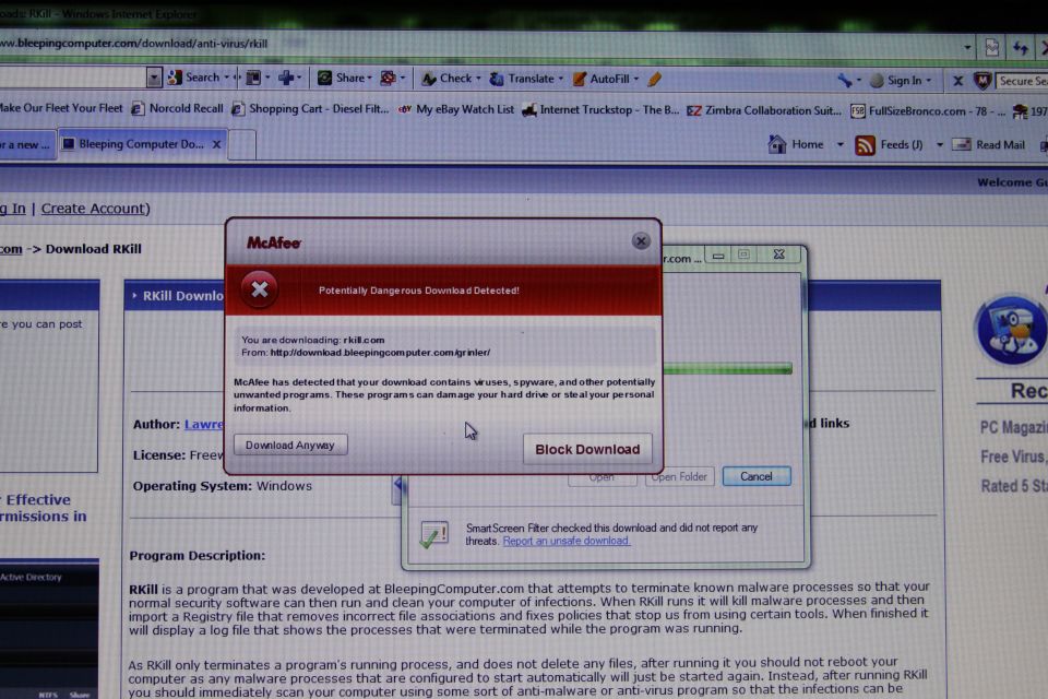 Computer screen showing McAfee antivirus warning about a potentially dangerous download