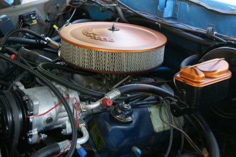1978 Ford Bronco - Close-up of a vehicle's engine bay, highlighting the air filter and master cylinder.