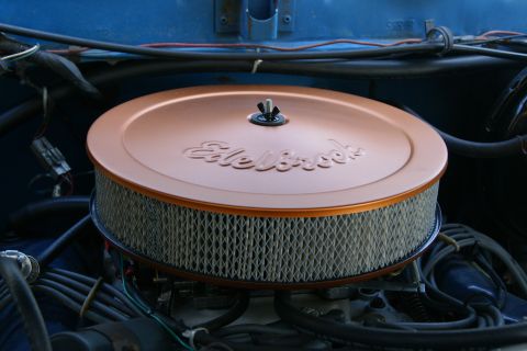 1978 Ford Bronco - Aftermarket Edelbrock air cleaner assembly on an engine.