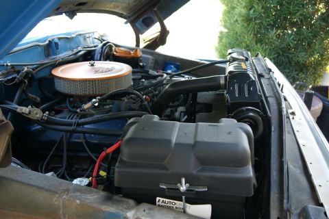 1978 Ford Bronco - Close-up view of the engine compartment, showing various mechanical components under the hood.
