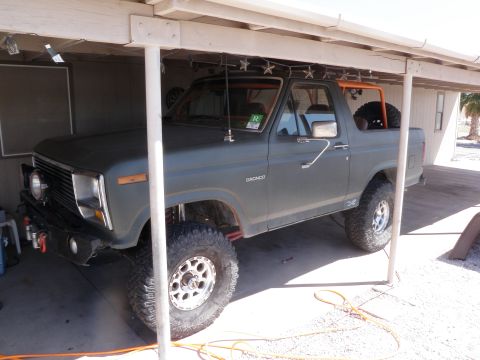 1982 Ford Bronco - This 1982 Ford Bronco is parked under a carport, showing its off-road modifications.