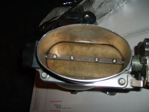 1993 Ford Crown Victoria - This is a throttle body, a component of a vehicle's engine system.
