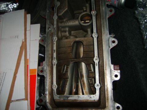 1993 Ford Crown Victoria - This is a close-up view of an engine intake manifold, showing internal components and some discoloration.
