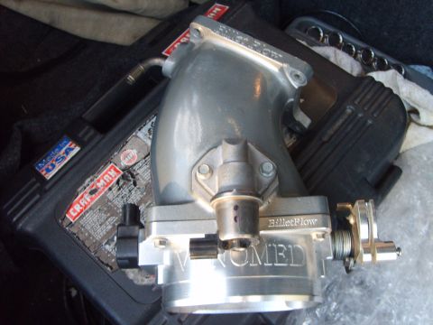 1993 Ford Crown Victoria - A BilletFlow throttle body, possibly for a Vortec engine, is shown with a Craftsman tool case.