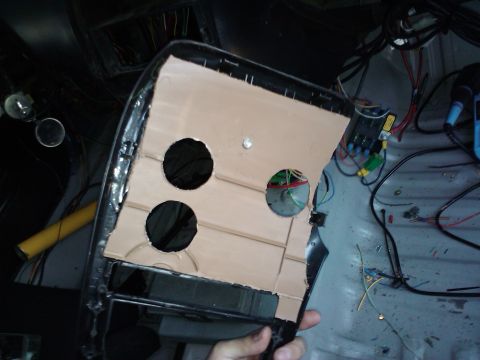 1995 Ford Probe - A custom dashboard panel with multiple circular cutouts and visible wiring is held in place, suggesting interior modification.