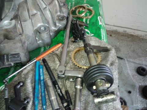 1995 Ford Probe - Various transmission shifter components are laid out on a towel, including gears, linkage, and tools.