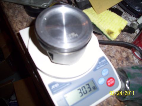 1995 Ford Probe - A piston is weighed on a digital scale, displaying 303 grams. The photo is dated August 24, 2011.