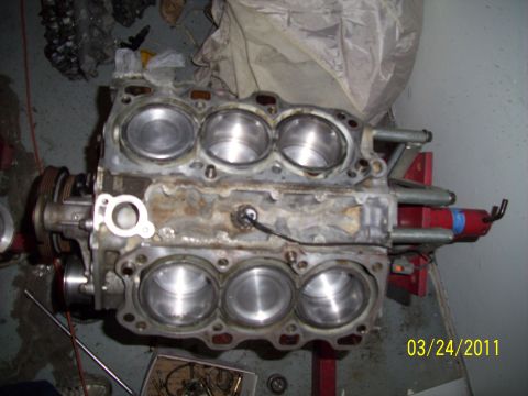 1995 Ford Probe - Engine block with cylinders visible, mounted on a stand.