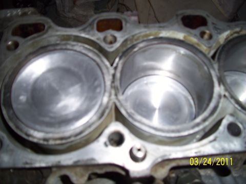 1995 Ford Probe - The internal components of an engine block are shown, with visible cylinder bores and a date watermark.