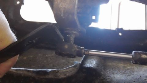 1994 Ford Bronco - Close-up view of a mechanical linkage system, likely from a vehicle's drivetrain or suspension.