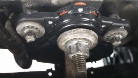 1994 Ford Bronco - Underside view of a vehicle's suspension system, focusing on a specific repair part.
