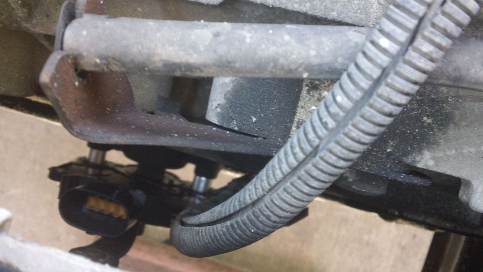 Close-up of a vehicle's electrical connector and wiring harness