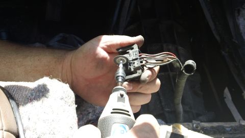 1994 Ford Bronco - Modifying an electrical connector with a rotary tool for repair or modification.