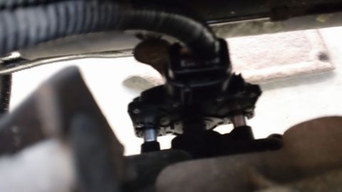 1994 Ford Bronco - Detail of an automotive part, possibly from a vehicle's engine bay or undercarriage.