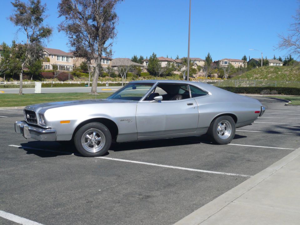 Silver 1972 Ford Gran Torino Sport parked in a lot