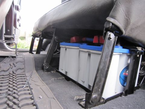 2008 Jeep Wrangler - Dual batteries are visible mounted beneath the seat of the vehicle.