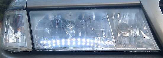 Car headlight with LED strip installed