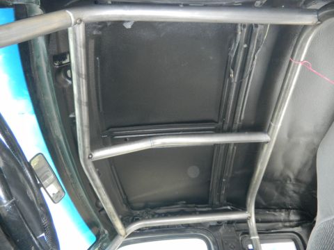 1997 Ford Ranger - A custom metal roll cage is visible inside the vehicle's interior, obscuring the headliner.