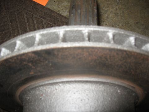 1968 Shelby GT500 - A close-up view of a vented brake rotor, showing wear and rust.