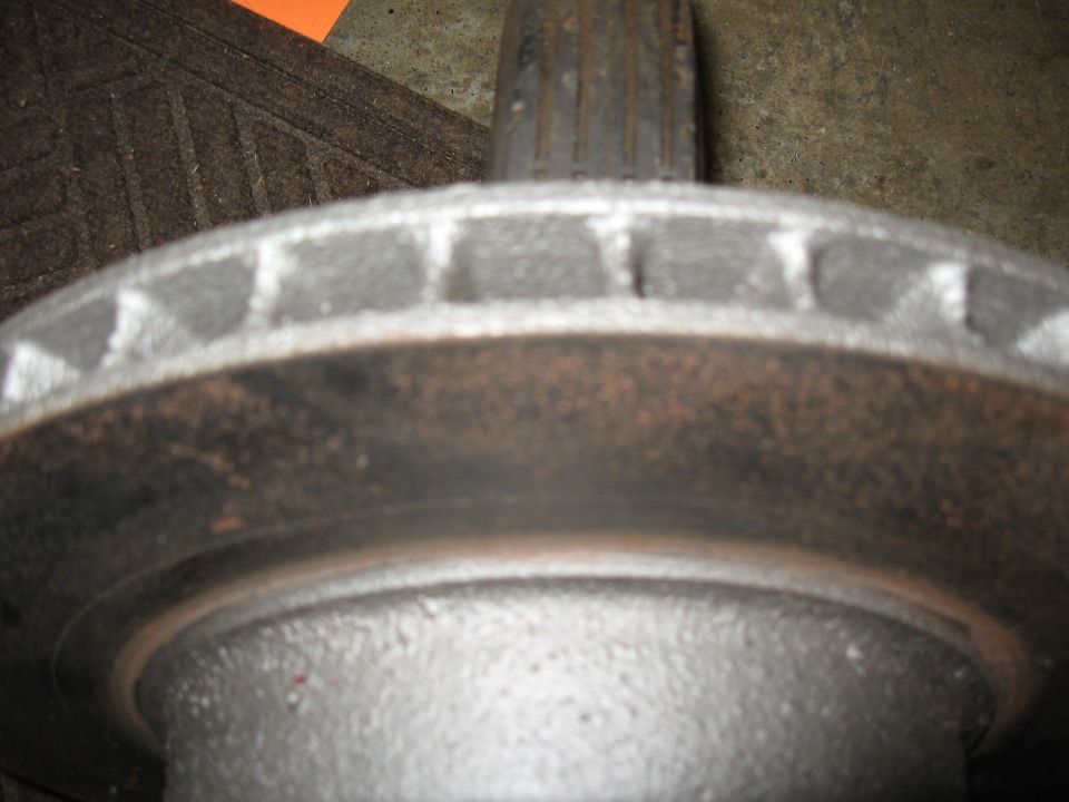 close-up of a car brake rotor with ventilation slots