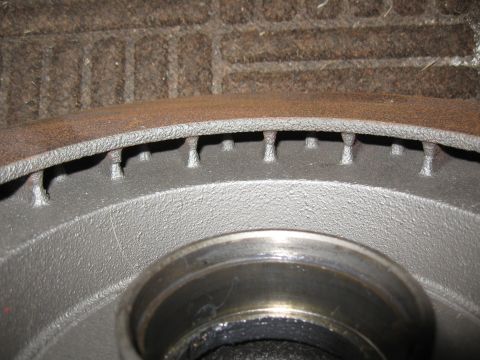 1968 Shelby GT500 - A close-up view of a vented brake rotor, showing some surface rust on its edge.